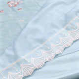 Azure Bloom Comforter | Luxurious Satin Comforter with Golden Floral Embroidery closeup view.