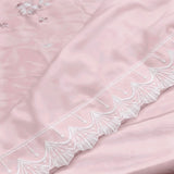 Blush Petal Comforter | Satin Embroidered Floral Comforter in Soft Blush Cream Closeup view.