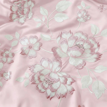 Blush Petal Comforter | Satin Embroidered Floral Comforter in Soft Blush Cream Focus view. 