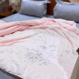 Blush Petal Comforter | Satin Embroidered Floral Comforter in Soft Blush Cream Overall view.