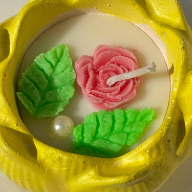Handcrafted Yellow Petal Soy Candle | Floral Cement Candle with Pink Rose & Botanical Accents Closeup view