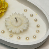 Handmade Oval Candle with Yellow Rose & White Floral Carvings | side view