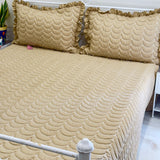 brown quilted bedcover with frills | Side view