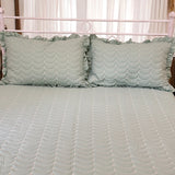 green quilted king size bedcover with frills | front view
