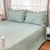 green quilted king size bedcover with frills | overall view
