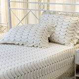 white quilted bedcover with frills | focus view