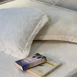 white warm self design bedsheet | close view